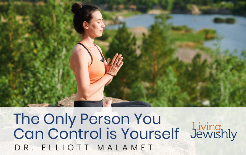 The Only Person You Can Control is Yourself Featured Image-A woman sits on top of a cliff meditating in nature